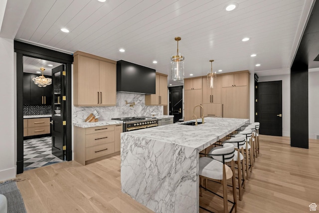 1643 E Box Elder Dr, Alpine, UT 84004 - kitchen featuring custom range hood, light brown cabinets, tasteful backsplash, light wood-style flooring, and recessed lighting