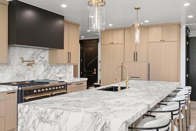 1643 E Box Elder Dr, Alpine, UT 84004 - kitchen featuring light brown cabinetry, range hood, recessed lighting, light stone countertops, and range with two ovens