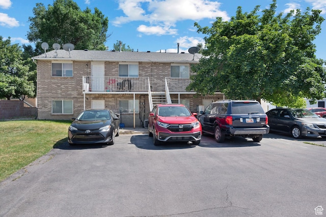 835 E 500 N, Spanish Fork, UT 84660 - view of front facade with brick siding, uncovered parking, and a front lawn