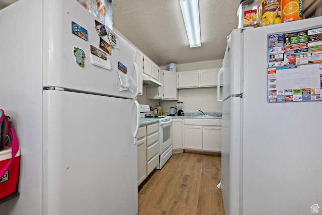 835 E 500 N, Spanish Fork, UT 84660 - kitchen featuring white appliances, light wood-style flooring, white cabinetry, and light countertops