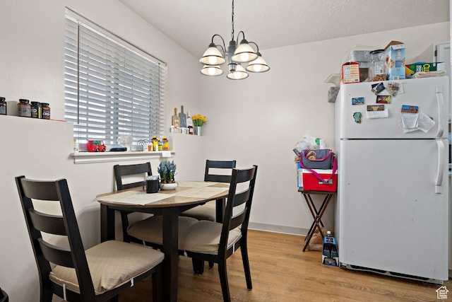 835 E 500 N, Spanish Fork, UT 84660 - dining room with a chandelier and light wood-style floors