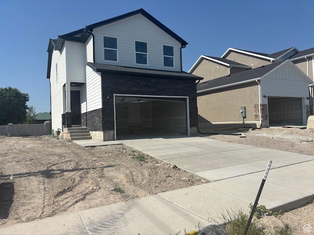 1719 W Brocious Way S Unit 301, South Jordan, UT 84095 - view of front of property featuring an attached garage and driveway