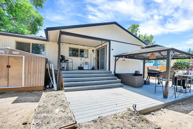 122 W 5300 S, Washington Terrace, UT 84405 - view of front of house with a gazebo, a wooden deck, and an outdoor living space