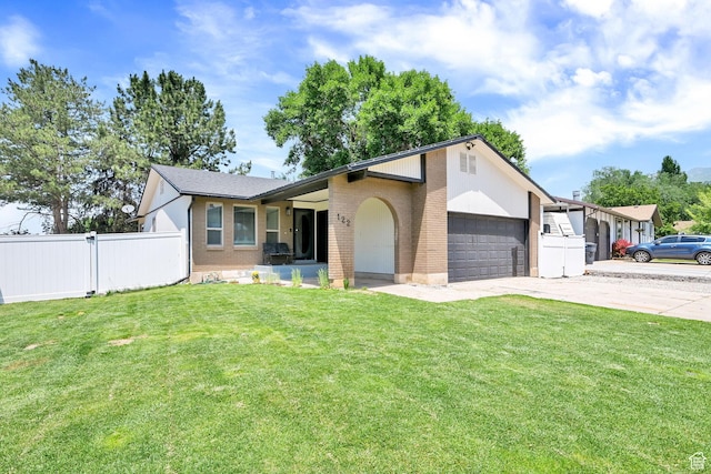 122 W 5300 S, Washington Terrace, UT 84405 - view of front of property featuring concrete driveway, a garage, and brick siding