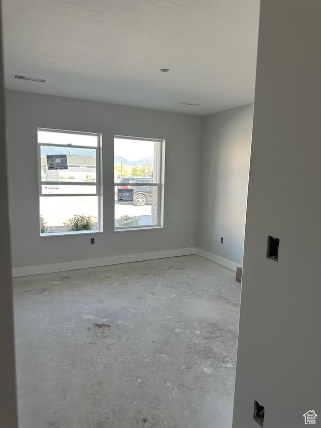 2613 S 2430 W Unit 111, Syracuse, UT 84075 - unfurnished room with a textured ceiling and concrete floors