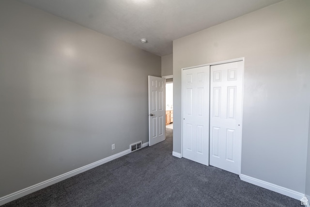 271 E Eagle Ridge Dr, North Salt Lake, UT 84054 - unfurnished bedroom with dark colored carpet and a closet