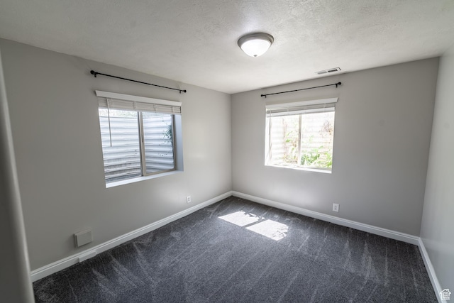 271 E Eagle Ridge Dr, North Salt Lake, UT 84054 - carpeted empty room featuring healthy amount of natural light and a textured ceiling