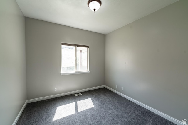 271 E Eagle Ridge Dr, North Salt Lake, UT 84054 - spare room featuring dark colored carpet and baseboards