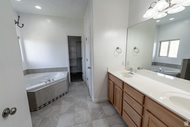 271 E Eagle Ridge Dr, North Salt Lake, UT 84054 - bathroom featuring a garden tub, double vanity, a walk in closet, and a chandelier