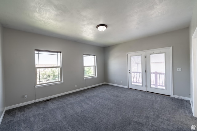 271 E Eagle Ridge Dr, North Salt Lake, UT 84054 - spare room with dark colored carpet and baseboards