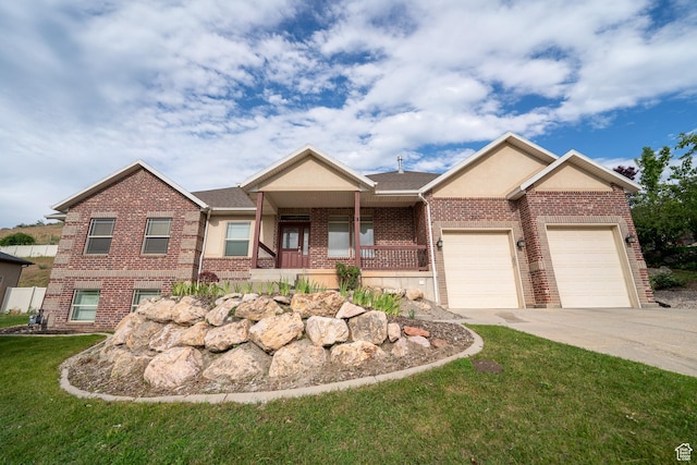 271 E Eagle Ridge Dr, North Salt Lake, UT 84054 - view of front of home with brick siding, concrete driveway, a garage, a front lawn, and covered porch
