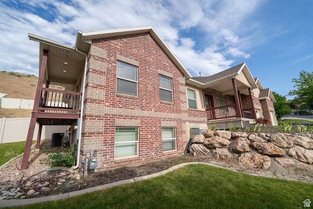 271 E Eagle Ridge Dr, North Salt Lake, UT 84054 - view of property exterior with brick siding and a cooling unit