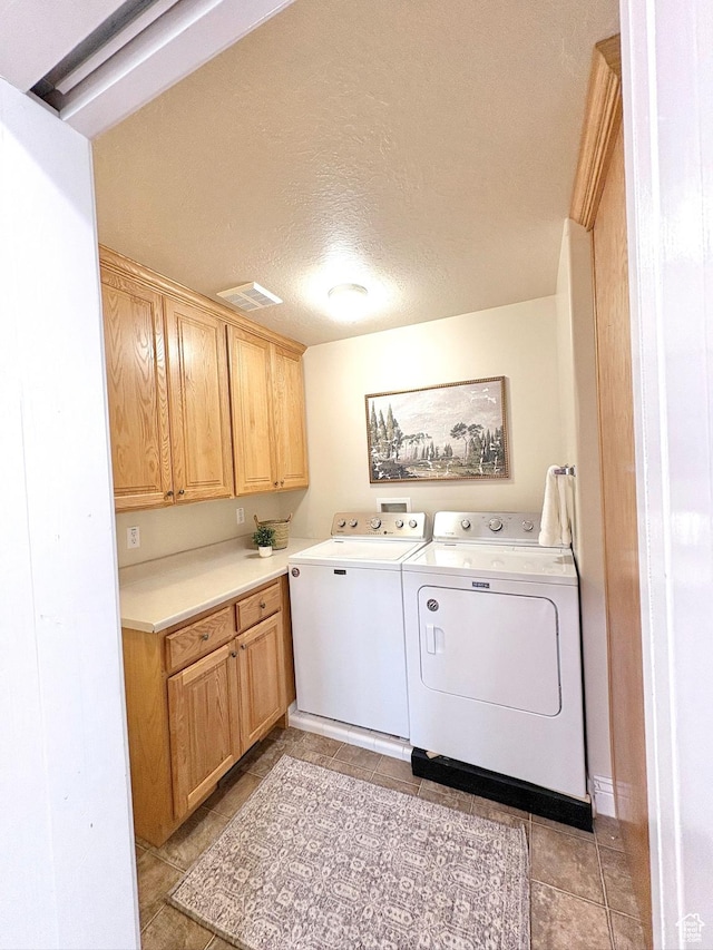 1017 E 450 N Cir N, American Fork, UT 84003 - washroom featuring washing machine and dryer, cabinet space, a textured ceiling, and light tile patterned floors