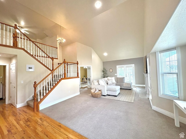 1017 E 450 N Cir N, American Fork, UT 84003 - living room featuring stairs, high vaulted ceiling, a chandelier, and carpet