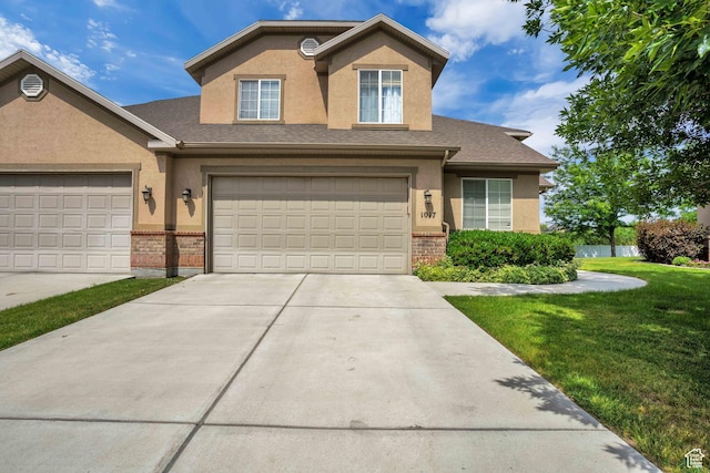 1017 E 450 N Cir N, American Fork, UT 84003 - traditional-style home featuring stucco siding, brick siding, and concrete driveway