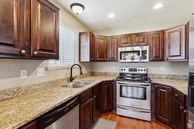 3119 N Whitetail Dr Unit 85, Layton, UT 84040 - kitchen featuring appliances with stainless steel finishes, dark wood-style floors, recessed lighting, light stone countertops, and dark brown cabinets