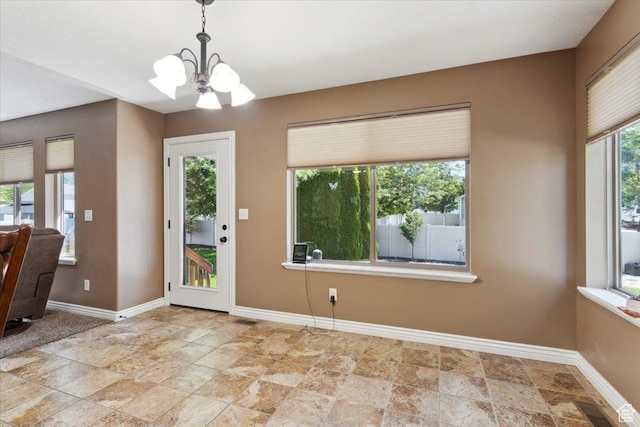 3146 N 750 W, Pleasant View, UT 84414 - unfurnished dining area featuring stone finish floors and a chandelier