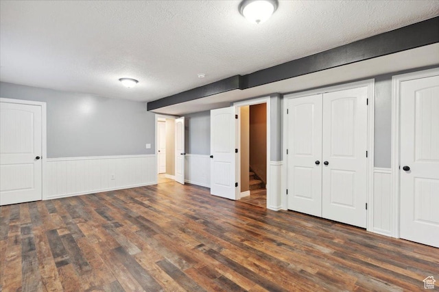 3146 N 750 W, Pleasant View, UT 84414 - finished basement with wood finished floors, a textured ceiling, and wainscoting