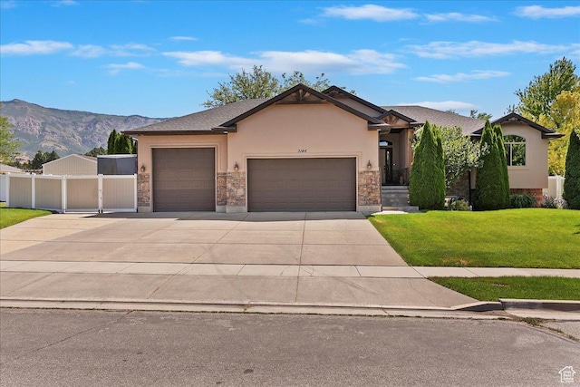 3146 N 750 W, Pleasant View, UT 84414 - ranch-style home with stucco siding, an attached garage, driveway, a mountain view, and stone siding