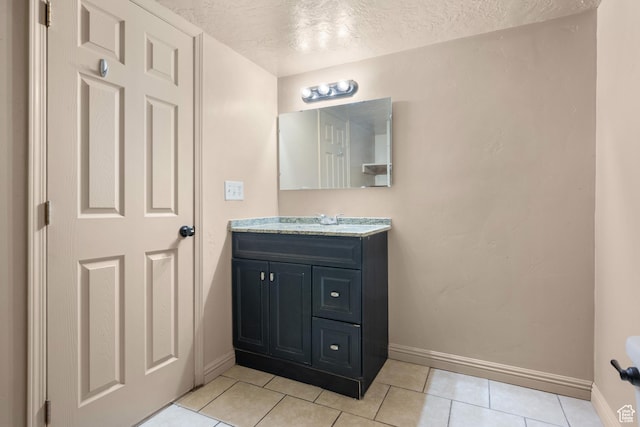 6097 W Cedar Hill Rd S, West Jordan, UT 84081 - bathroom with vanity, a textured ceiling, and tile patterned flooring