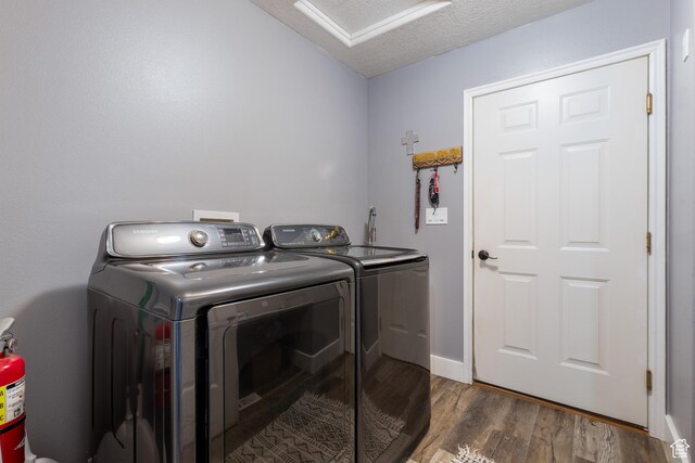 3712 N 250 E, Enoch, UT 84721 - laundry area featuring washing machine and clothes dryer, dark wood-type flooring, attic access, and a textured ceiling