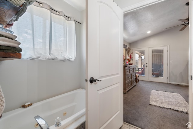 3712 N 250 E, Enoch, UT 84721 - bathroom featuring lofted ceiling, a jetted tub, a ceiling fan, and french doors