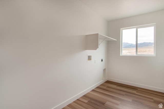 1170 W High Plains Dr Unit 609, Grantsville, UT 84029 - laundry area featuring hookup for an electric dryer, washer hookup, light wood-style floors, and a mountain view