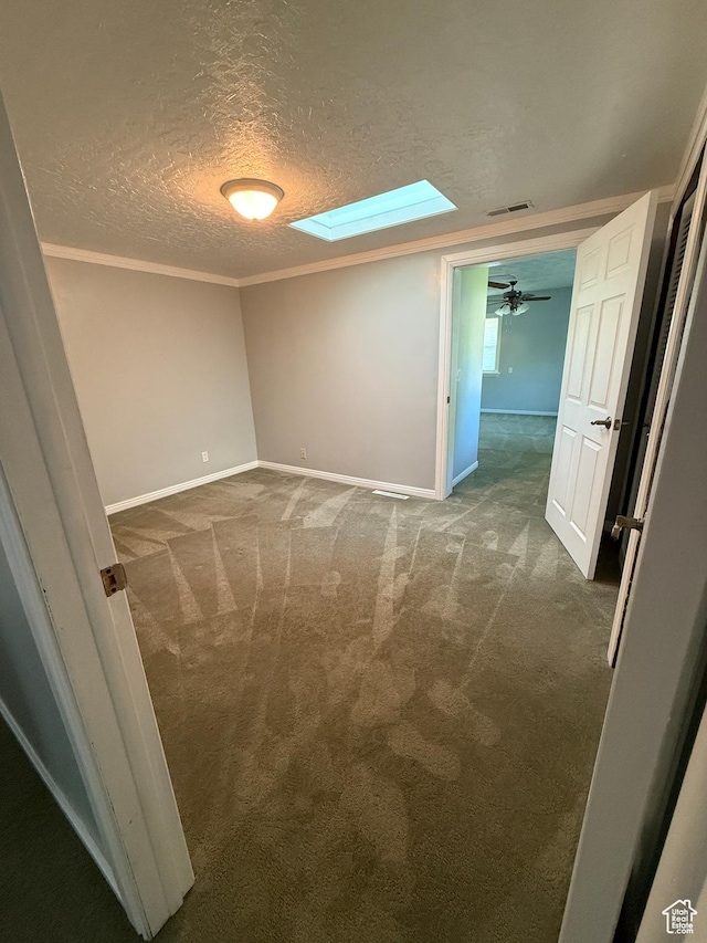 1885 S 50 W, Bountiful, UT 84010 - carpeted spare room with a skylight, a textured ceiling, ornamental molding, and ceiling fan