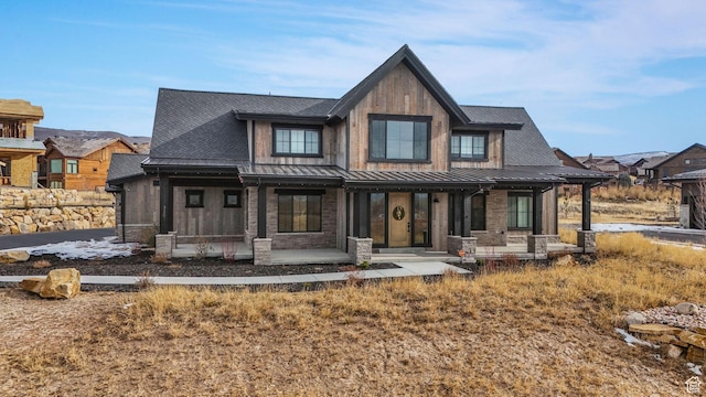 330 N Haystack Mountain Dr, Heber City, UT 84032 - view of front facade with a porch, a standing seam roof, board and batten siding, a metal roof, and a shingled roof