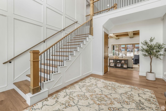 330 N Haystack Mountain Dr, Heber City, UT 84032 - staircase with wood finished floors, a high ceiling, and beamed ceiling