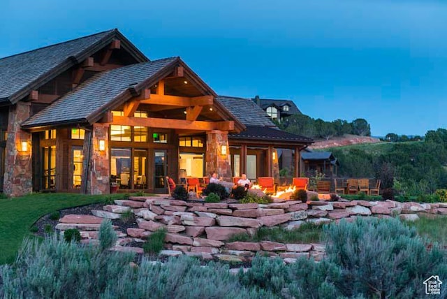 330 N Haystack Mountain Dr, Heber City, UT 84032 - back of house with a fire pit and stone siding