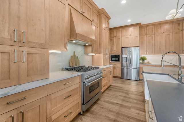 330 N Haystack Mountain Dr, Heber City, UT 84032 - kitchen with appliances with stainless steel finishes, custom range hood, light wood-style floors, recessed lighting, and backsplash