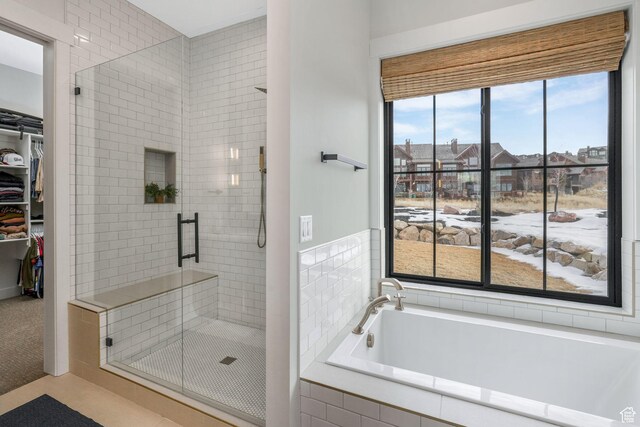 330 N Haystack Mountain Dr, Heber City, UT 84032 - bathroom with a shower stall, a bath, a spacious closet, and a residential view