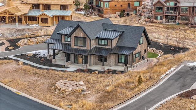 330 N Haystack Mountain Dr, Heber City, UT 84032 - view of front of house with a standing seam roof, a porch, a shingled roof, and a metal roof