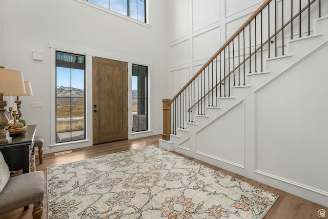 330 N Haystack Mountain Dr, Heber City, UT 84032 - foyer with healthy amount of natural light, stairs, a high ceiling, and wood finished floors