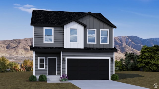 2342 E Woodbury Ln S Unit 547, Eagle Mountain, UT 84005 - view of front of house with board and batten siding, a mountain view, driveway, and a garage