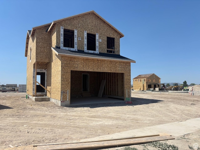 2362 E Woodbury Ln Unit 548, Eagle Mountain, UT 84005 - view of front facade with a garage and driveway