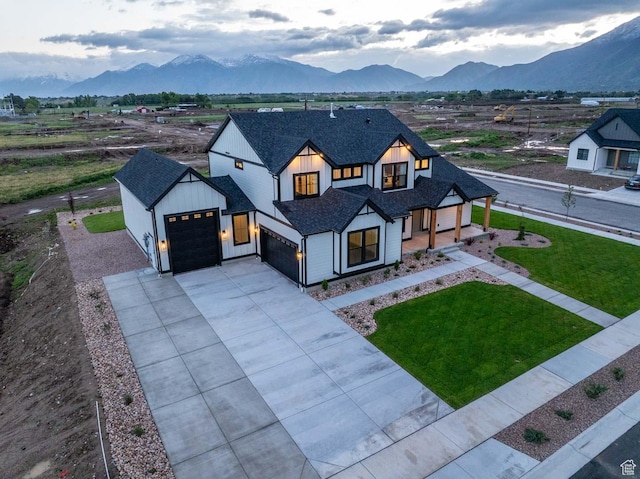 1587 E 820 N Unit 108, Salem, UT 84653 - modern farmhouse style home featuring an attached garage, a mountain view, driveway, a shingled roof, and a front yard