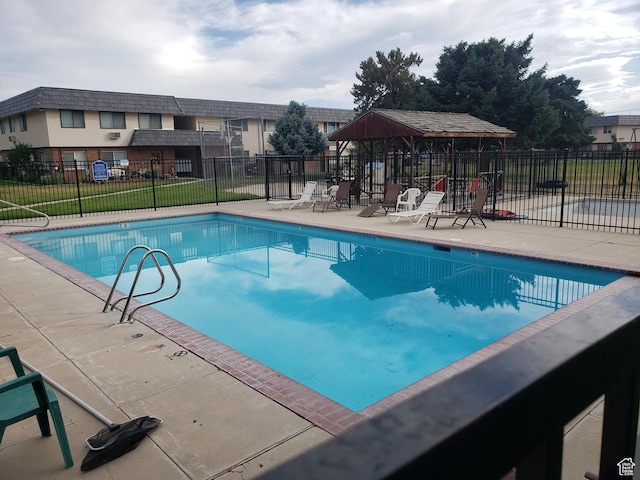 4480 S Atherton Dr Unit 22, Taylorsville, UT 84123 - community pool featuring a patio