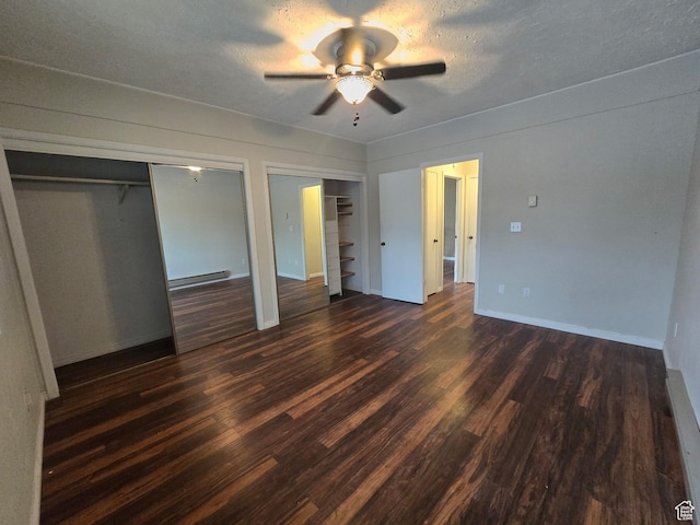4480 S Atherton Dr Unit 22, Taylorsville, UT 84123 - unfurnished bedroom with multiple closets, dark wood-style floors, a baseboard radiator, and a ceiling fan