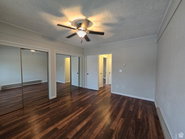 4480 S Atherton Dr Unit 22, Taylorsville, UT 84123 - unfurnished bedroom with baseboard heating, two closets, dark wood finished floors, a textured ceiling, and a ceiling fan