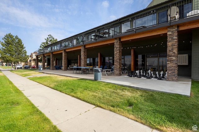 2176 S Bear Blvd # 421, Garden City, UT 84028 - view of community featuring a yard and a patio