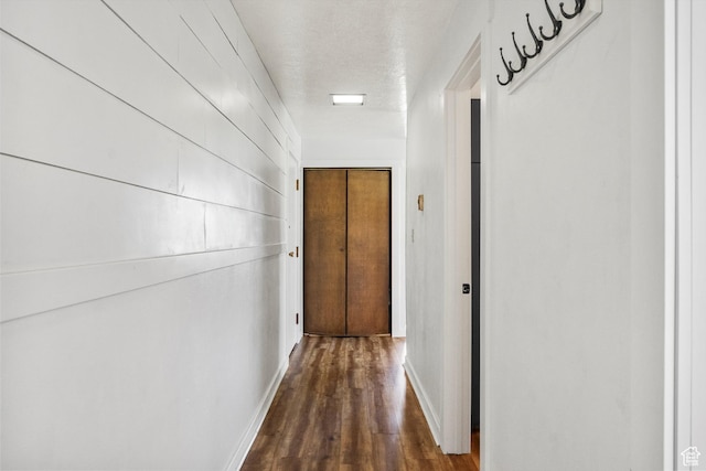2176 S Bear Blvd # 421, Garden City, UT 84028 - hallway featuring dark wood-style flooring and a textured ceiling