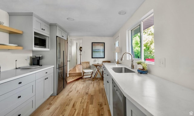 1155 N Pinecrest Canyon Rd, Salt Lake City, UT 84108 - kitchen featuring stainless steel appliances, light countertops, light wood-type flooring, and open shelves