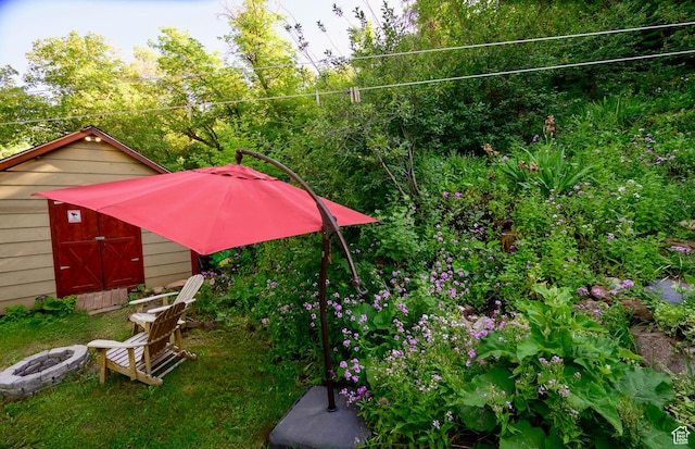 1155 N Pinecrest Canyon Rd, Salt Lake City, UT 84108 - view of yard with a fire pit and a storage unit