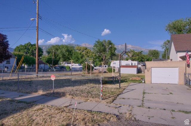 59 S S 400 E, American Fork, UT 84003 - view of yard with a garage and concrete driveway
