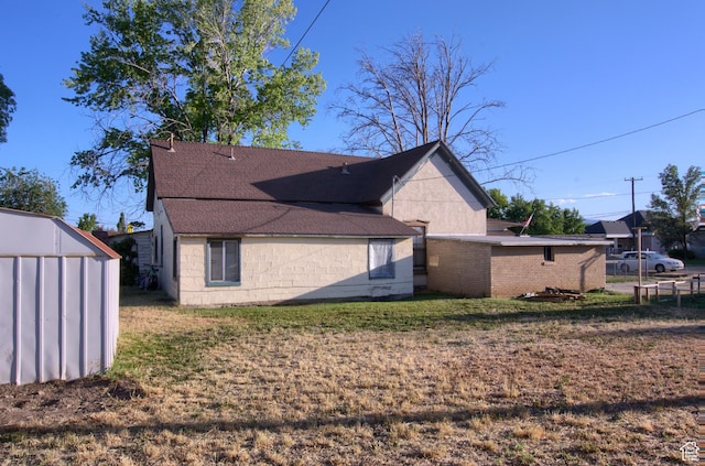 59 S S 400 E, American Fork, UT 84003 - back of property with roof with shingles, a yard, and concrete block siding