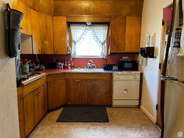 59 S S 400 E, American Fork, UT 84003 - kitchen featuring dishwasher, stainless steel cooktop, black microwave, freestanding refrigerator, and brown cabinets