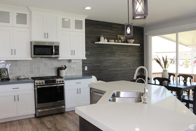 13693 S Blayde Dr, Herriman, UT 84096 - kitchen featuring stainless steel appliances, white cabinetry, pendant lighting, tasteful backsplash, and recessed lighting