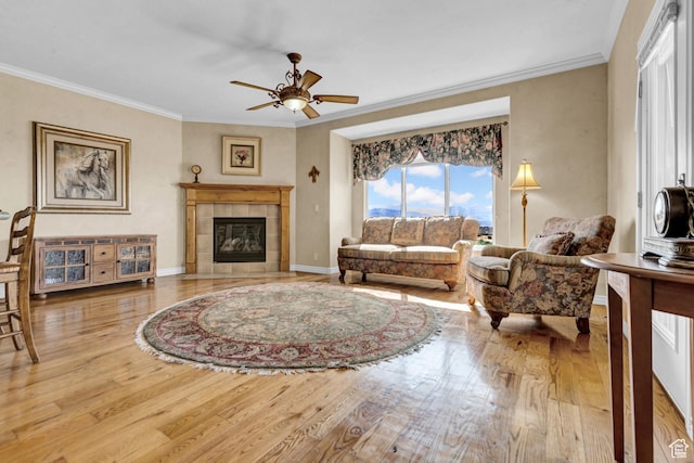 285 E Brayden Way, Draper, UT 84020 - living room with wood finished floors, crown molding, ceiling fan, and a tiled fireplace